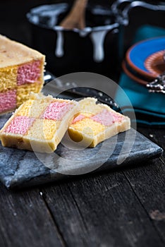 Serving Battenberg checked cake