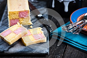 Serving Battenberg checked cake