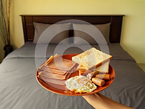 Serving breakfast in luxury bedroom