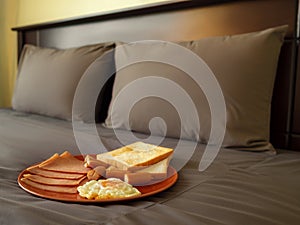 Serving breakfast in luxury bedroom