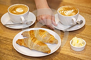 Serving cappuccino with Croissants