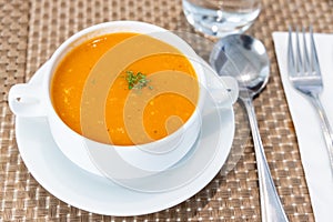 Serving of creamy tomato soup at restaurant
