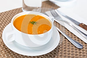 Serving of creamy tomato soup at restaurant