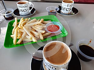 serving of expresso coffee and french fries