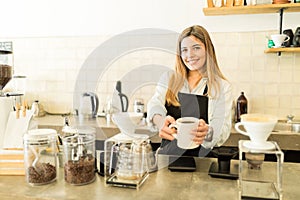 Serving fresh coffee at a cafe