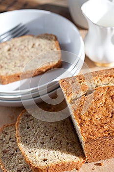 Serving freshly baked banana bread on wooden board