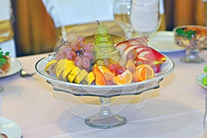 Serving fruits at a festive new year and Christmas table