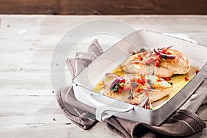 Serving of golden roasted chicken breasts photo