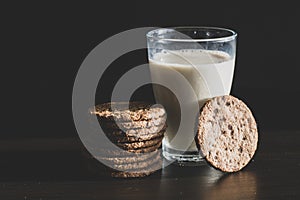 Serving healthy morning breakfast with a fresh milk in a glass and Pile of Delicious Chocolate homemade Chip Cookies on a vintage