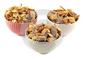 A Serving of Homemade Cereal Nut and Prezel Trail Mix Isolated on a White Background