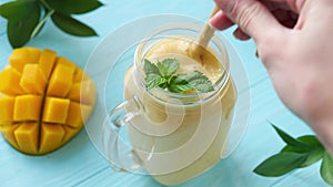 Serving jar of delicious tropical mango smoothie