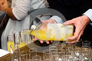 Serving limoncello in glasses photo