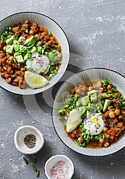 Serving lunch vegetarian buffalo chickpea chili with mushrooms on a gray background, top view. Healthy vegetarian food