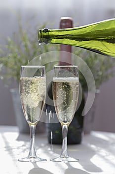 Serving a luxurious champagne in two glass glasses