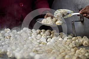 Serving nepalese momos