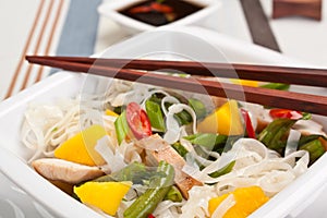 Serving of oriental warm noodle chicken salad