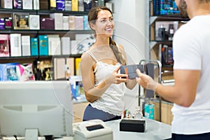 Serving purchaser at cash desk