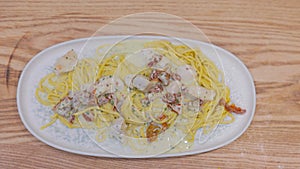 Serving and serving pasta in a restaurant. Italian pasta on a plate. Popular Italian food. tasty food, high haute