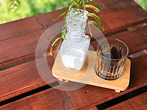 Serving size of Latte on the rock on the wooden tray  with natural light.