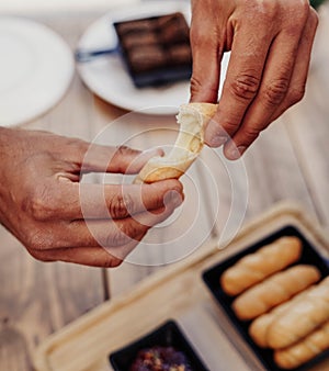 Serving of sticks stuffed with cheese called tequeÃ±os photo
