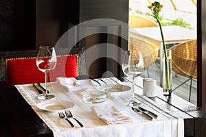 Serving at table and chair in empty restaurant photo