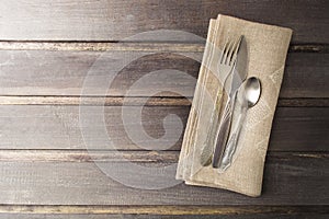 Serving table with rustic style and old flatware on wooden table