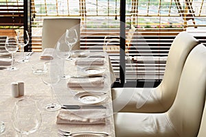 Serving at table with tablecloth in restaurant photo