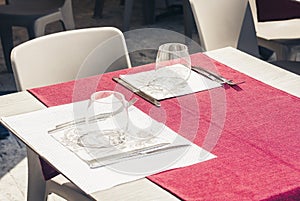 Serving on the table on terrace in the restaurant in Catania, Sicily, Italy, setting for diner