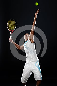 Serving a tennis ball