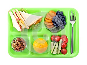 Serving tray with tasty healthy food isolated on white, top view. School dinner