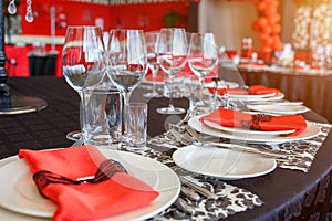 Serving of the wedding table, beautiful festive decor in red