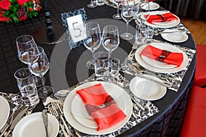 Serving of the wedding table, beautiful festive decor in red