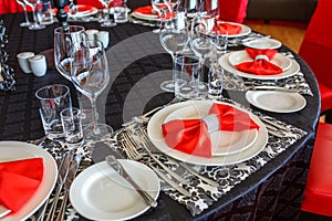 Serving of the wedding table, beautiful festive decor in red