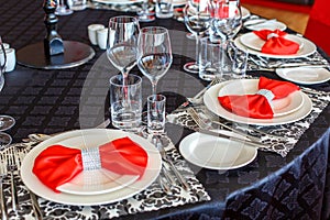 Serving of the wedding table, beautiful festive decor in red