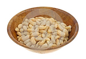 Serving of white beans in wood bowl