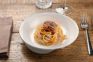 Serving of wild boar ragout on spaghetti Italian pasta