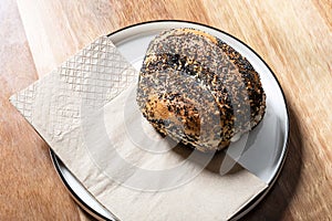 Sesame Bagel Sandwich Ready to Serve on a Plate in a Cafe