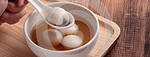 Sesame big tangyuan with syrup soup photo