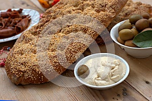 sesame bread, with traditional Mediterranean delicacies