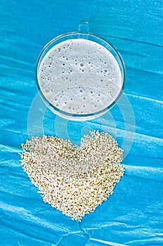 Sesame milk in a glass cup on a blue background