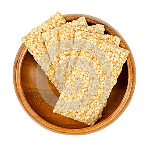 Sesame seed candy bars, sesame brittle or crunch in a wooden bowl photo