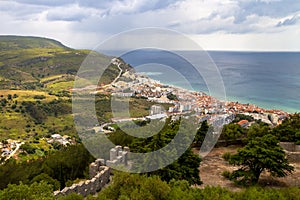 Sesimbra city general landscape seen from Sesimbra castle with the Atlantic ocean far beyond photo
