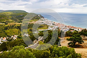 Sesimbra city general landscape seen from Sesimbra castle with the Atlantic ocean far beyond