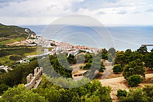 Sesimbra city general landscape seen from Sesimbra castle with the Atlantic ocean far beyond