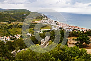 Sesimbra city general landscape seen from Sesimbra castle with the Atlantic ocean far beyond