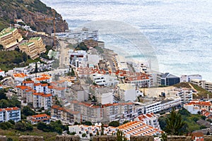 Sesimbra city general landscape seen from Sesimbra castle with the Atlantic ocean far beyond photo