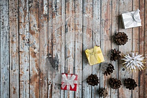 Sesonal background with small gifts and pine cones