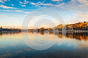 Sesto Calende, lake Maggiore, Ticino river, Italy. Beautiful sunrise on the promenade of Sesto Calende along the Ticino River