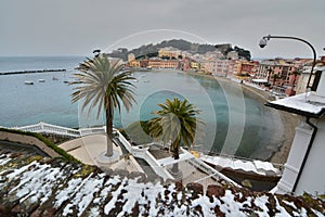 Light snow in Baia del Silenzio. Sestri Levante. Liguria, Italy photo