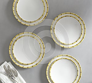 Set of 4 matching decorative plates for interior design - yellow waves. Vector illustration